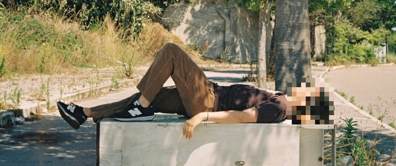 Header image of me lying down on a fridge I found on the side of the road.